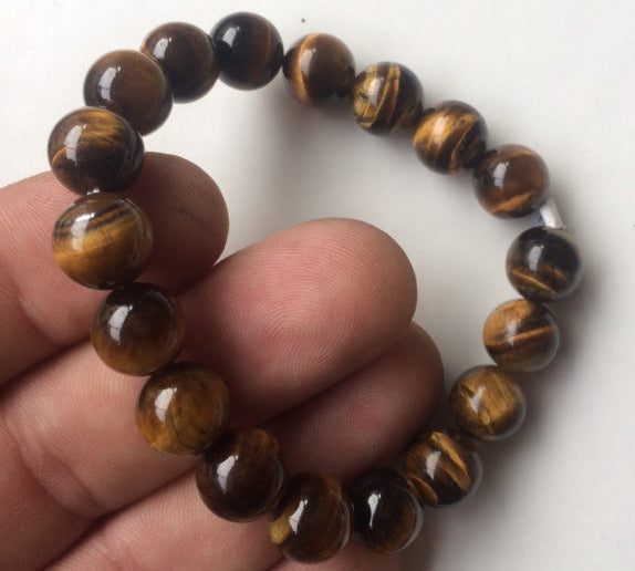 Œil de Tigre, perles rondes de 4, 6, 8 ou 10 mm. Vendu en fil de perle 38/39 cm, en bracelet de 17 à 21cm, en collier de 45 ou sautoir de 60cm. Qualité AA à AAA, superbes perles, belle pureté, parfait !