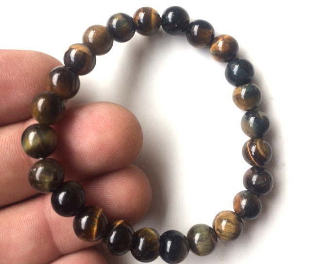 Œil de Tigre, perles rondes de 4, 6, 8 ou 10 mm. Vendu en fil de perle 38/39 cm, en bracelet de 17 à 21cm, en collier de 45 ou sautoir de 60cm. Qualité AA à AAA, superbes perles, belle pureté, parfait !
