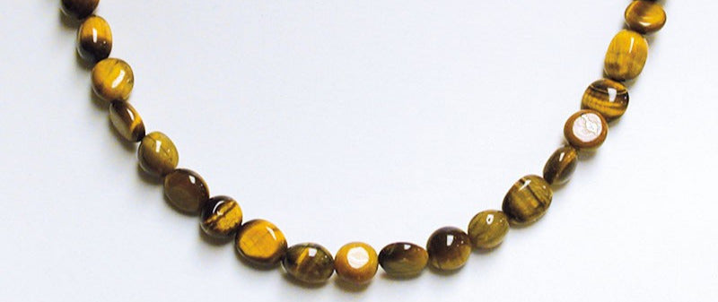 Œil de Tigre, bracelet de 17 à 21cm, collier de 42cm et sautoir de 60cm. Perles de type 'Graine' de formes naturelles montées sur fil de haute résistance !