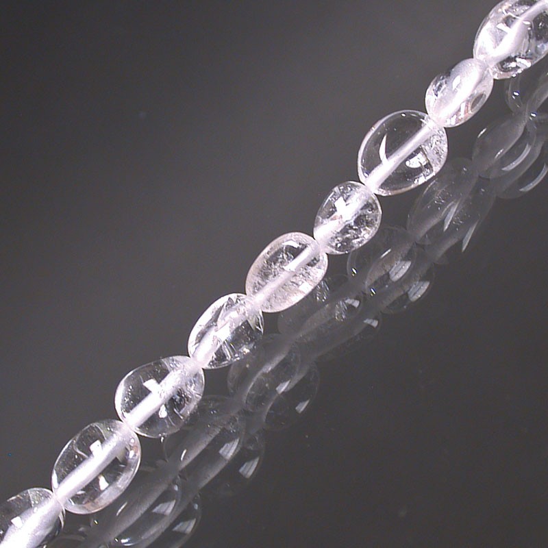 Cristal de roche (quartz), bracelet de 17 à 21cm, collier de 42cm et sautoir de 60cm. Perles de type 'Graine' de formes naturelles montées sur fil de haute résistance !
