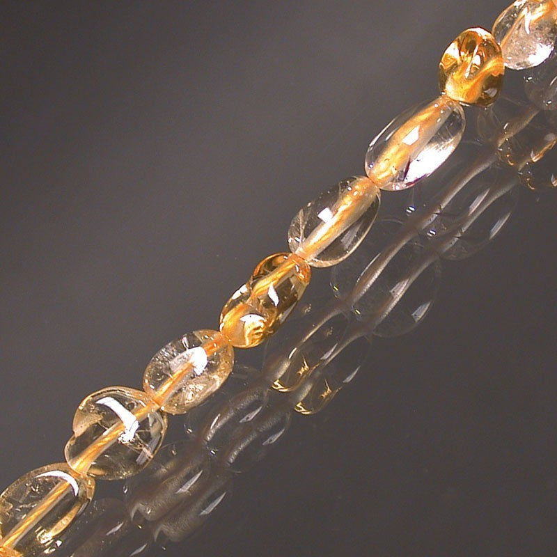 Citrine (quartz), bracelet de 17 à 21cm, collier de 42cm et sautoir de 60cm. Perles de type 'Graine' de formes naturelles montées sur fil de haute résistance !