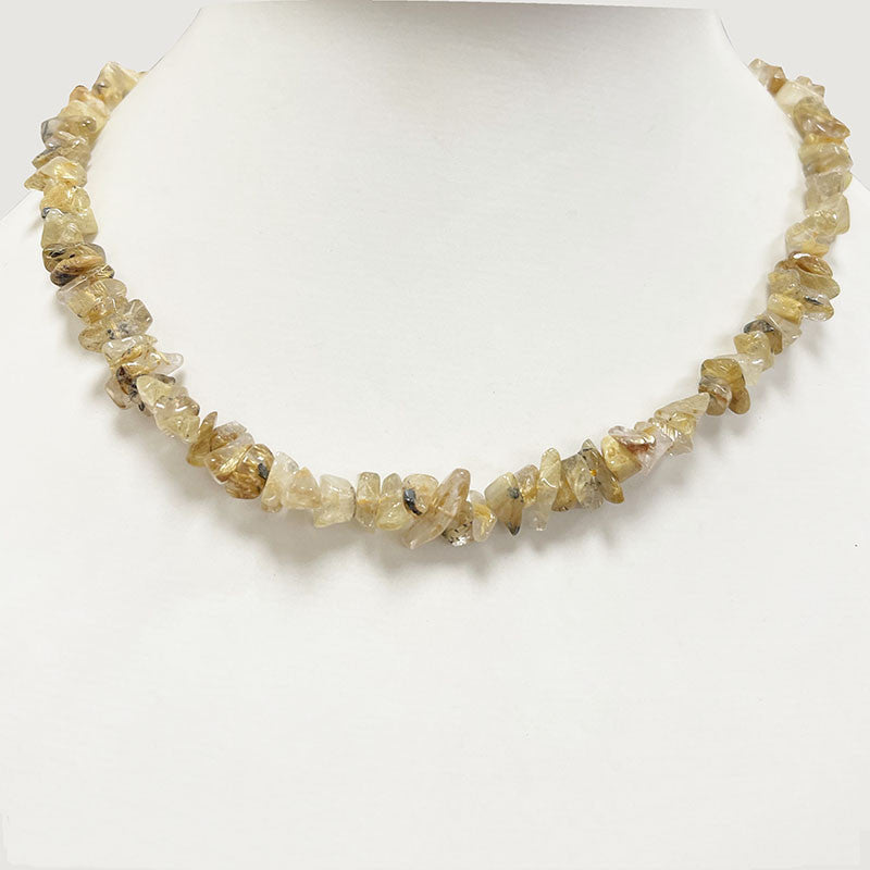 Cristal de roche (Quartz) a rutile doré, bracelet de 17 à 21cm, collier de 42cm et sautoir de 60cm. Perles de type 'Baroque' de formes naturelles montées sur fil de haute résistance !