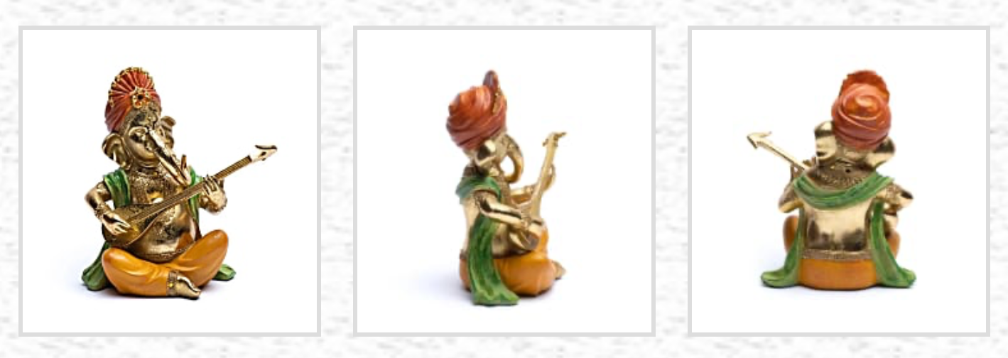 Ganesh assis jouant du SItar - 27 x 21 x 11 centimètres - 1280 grammes - Peint à la main !