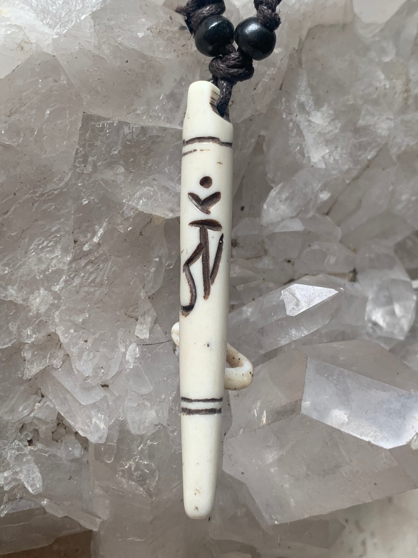 Elegant handcrafted pendant from Nepal, carved from bone with the sacred Om symbol, 60 millimeters high x 10 millimeters in diameter. Sold with a free adjustable black cord, perfect!