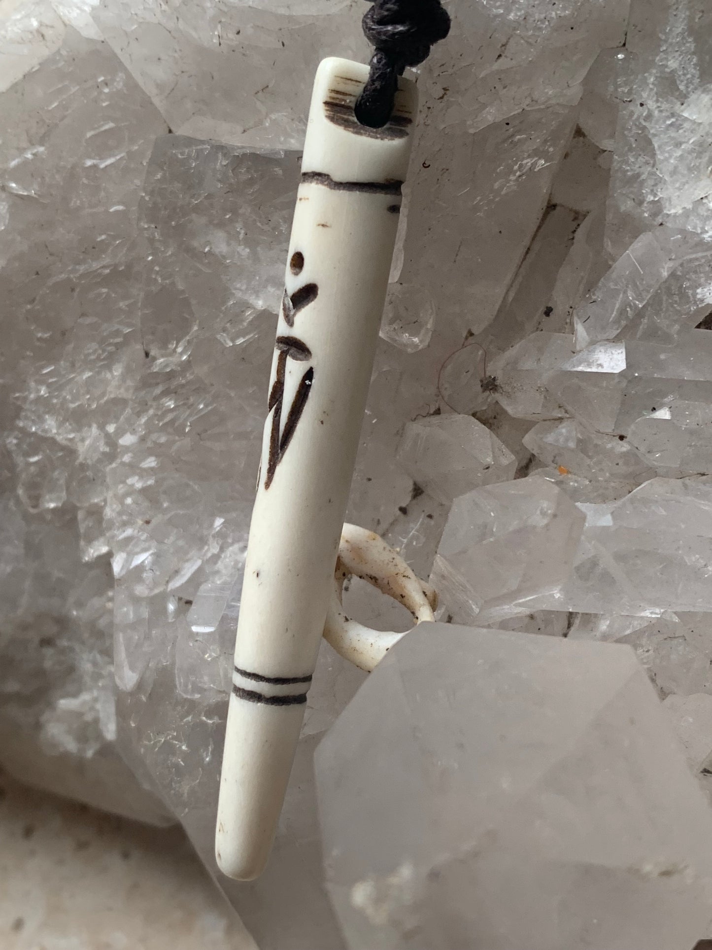Elegant handcrafted pendant from Nepal, carved from bone with the sacred Om symbol, 60 millimeters high x 10 millimeters in diameter. Sold with a free adjustable black cord, perfect!