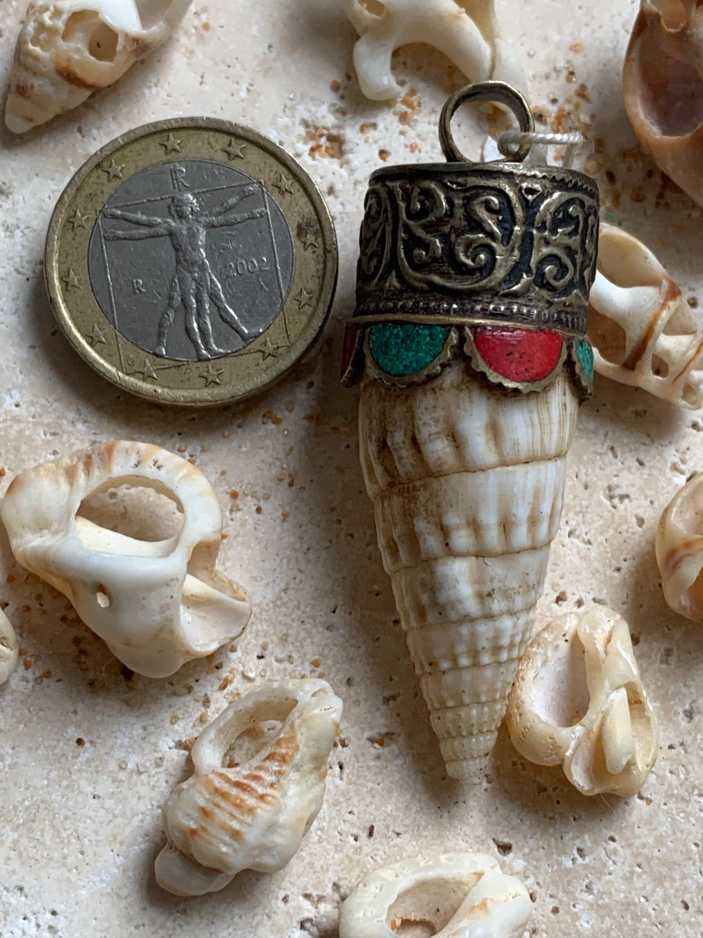 Handcrafted Nepalese shell pendant set in metal with beautiful engravings and turquoise with coral! 53 millimeters high x 18 mm in diameter. Sold with a free adjustable black cord, perfect!