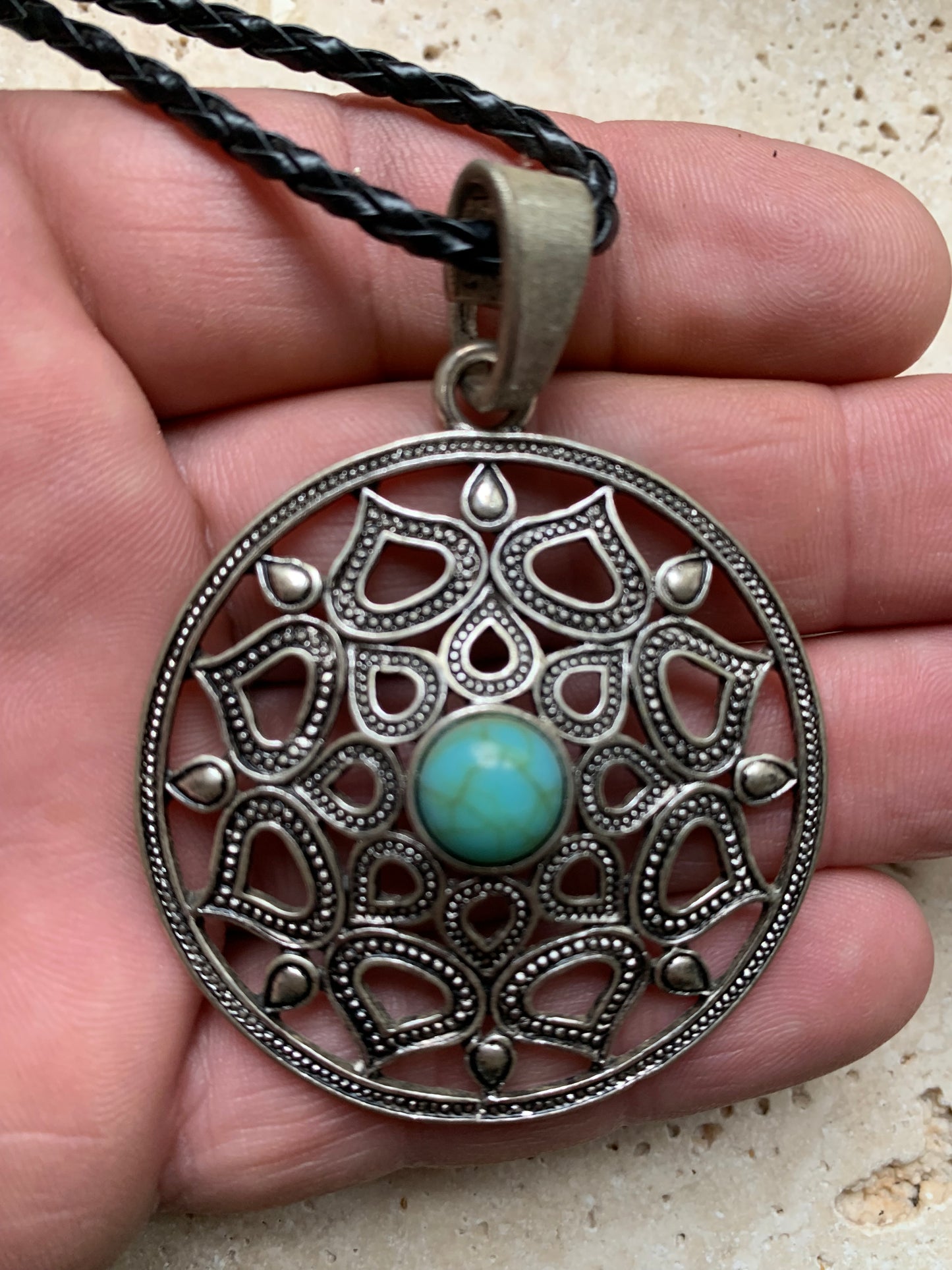 Silver-plated mandala pendant with a blue howlite cabochon in the center. 48 x 12 millimeters. Sold with a free adjustable black cord, perfect!