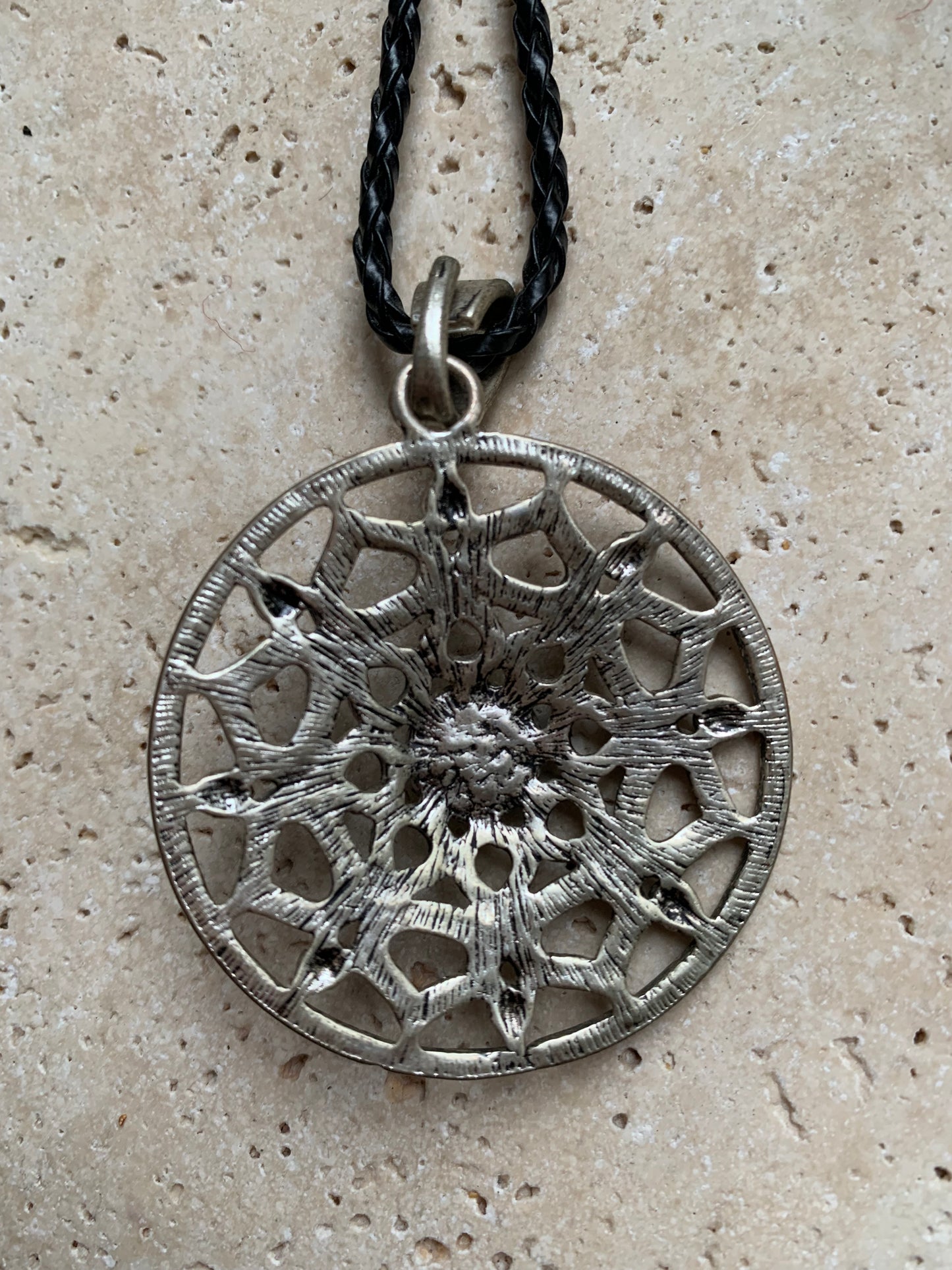 Silver-plated mandala pendant with a blue howlite cabochon in the center. 48 x 12 millimeters. Sold with a free adjustable black cord, perfect!