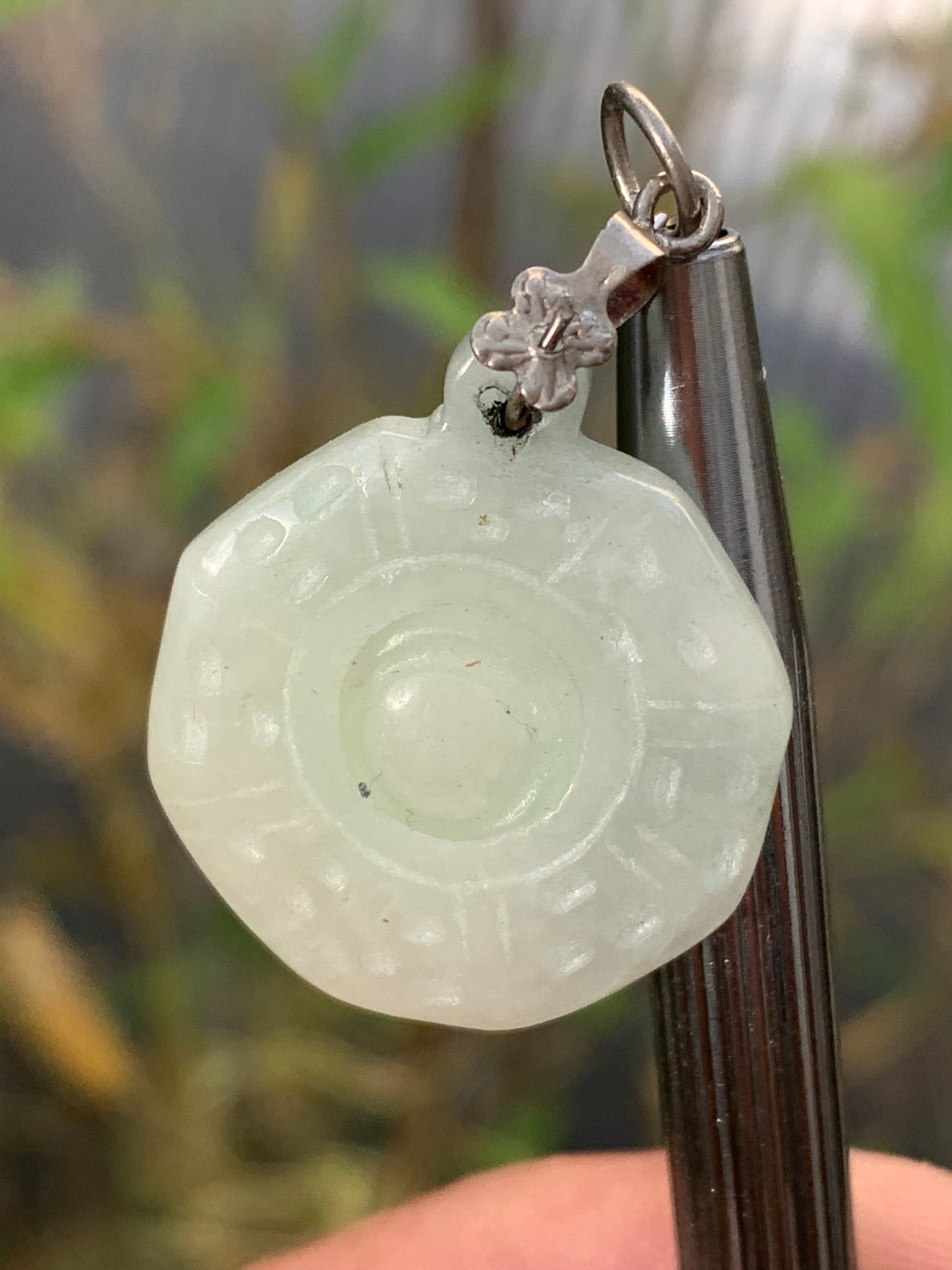 Jade! 'Wheel of Life' pendant with a pretty, fancy bail, 35 mm high x 23 mm wide x 5 mm thick. Sold with an adjustable black cord.