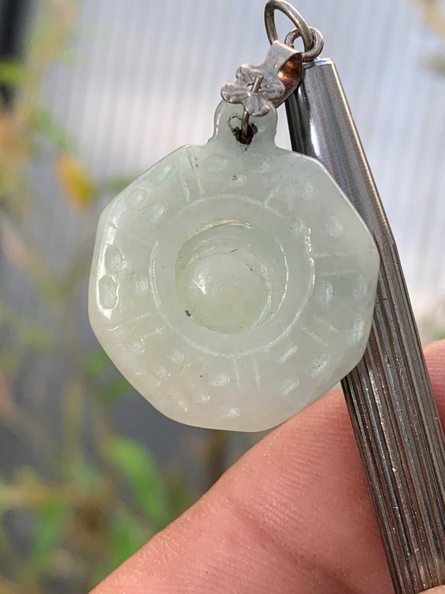 Jade! 'Wheel of Life' pendant with a pretty, fancy bail, 35 mm high x 23 mm wide x 5 mm thick. Sold with an adjustable black cord.