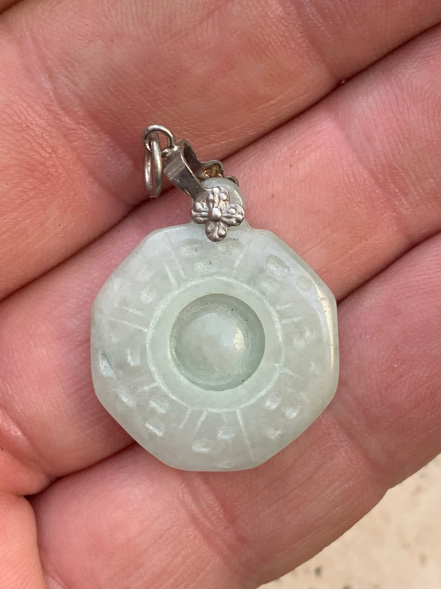 Jade! 'Wheel of Life' pendant with a pretty, fancy bail, 35 mm high x 23 mm wide x 5 mm thick. Sold with an adjustable black cord.
