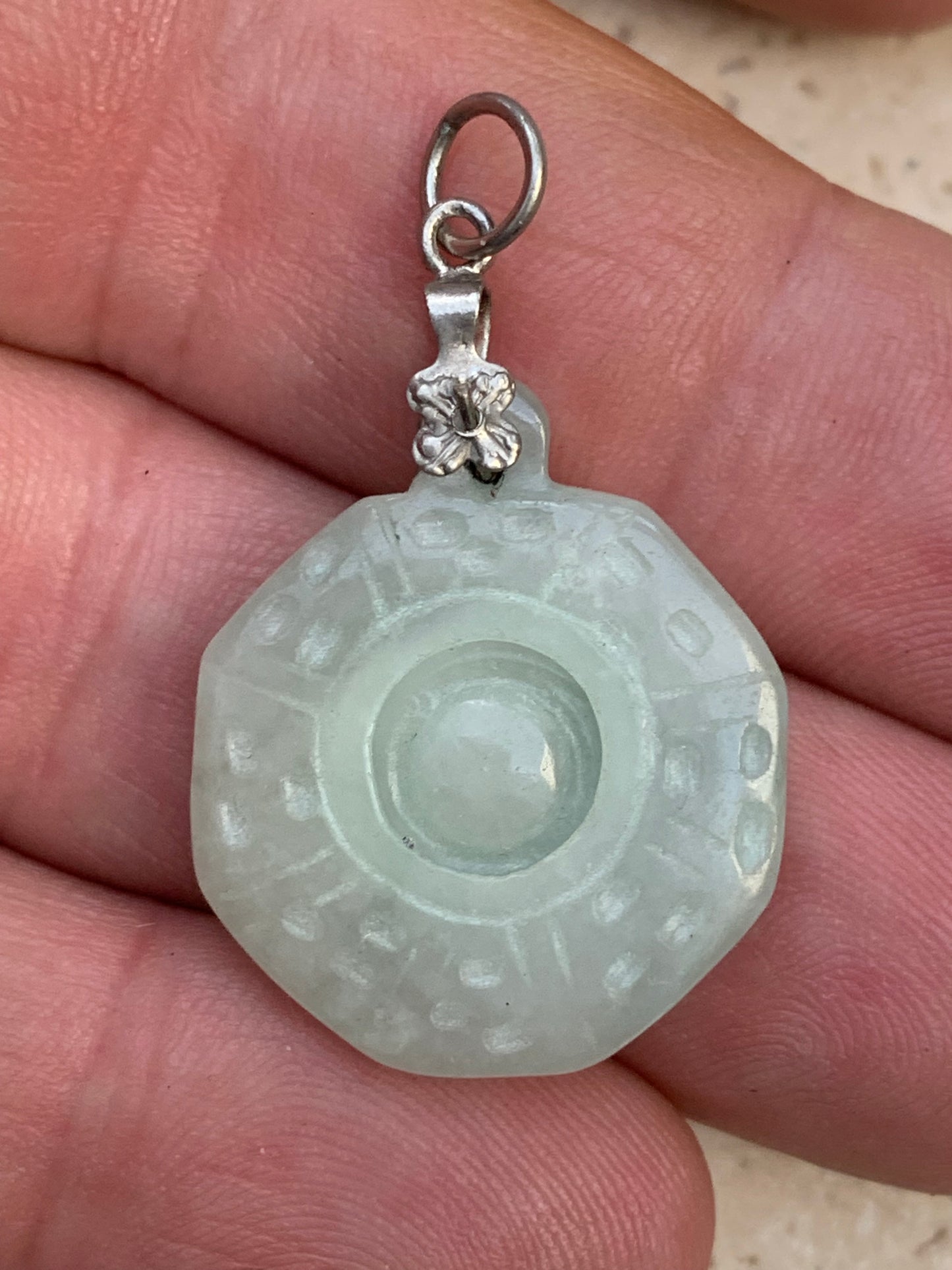Jade! 'Wheel of Life' pendant with a pretty, fancy bail, 35 mm high x 23 mm wide x 5 mm thick. Sold with an adjustable black cord.