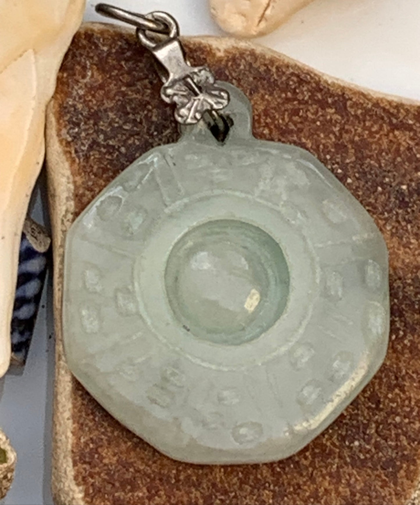Jade! 'Wheel of Life' pendant with a pretty, fancy bail, 35 mm high x 23 mm wide x 5 mm thick. Sold with an adjustable black cord.