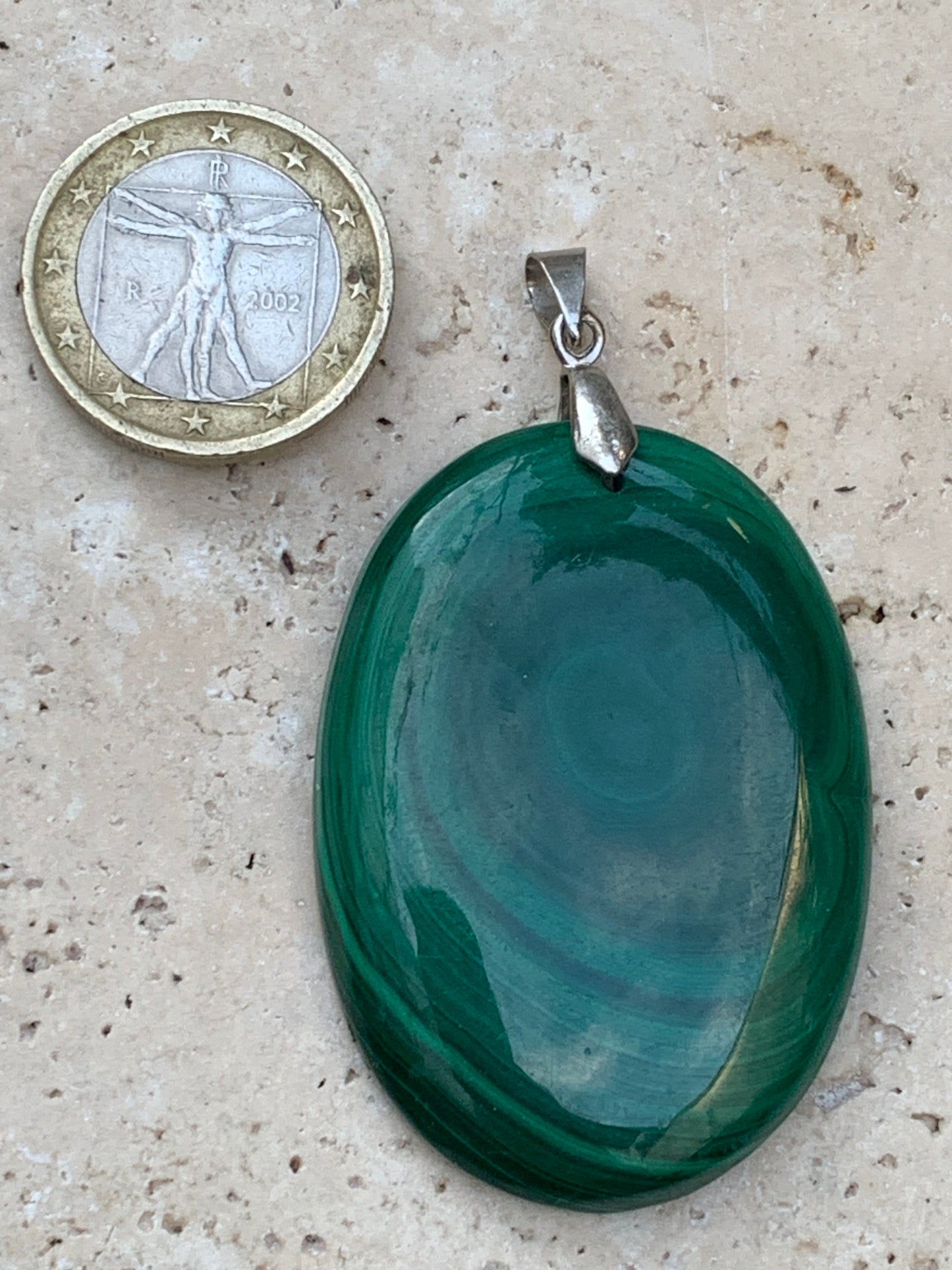 Malachite, superb pendant measuring 60mm high x 35mm wide x 8mm thick. Sold with an adjustable black cord.