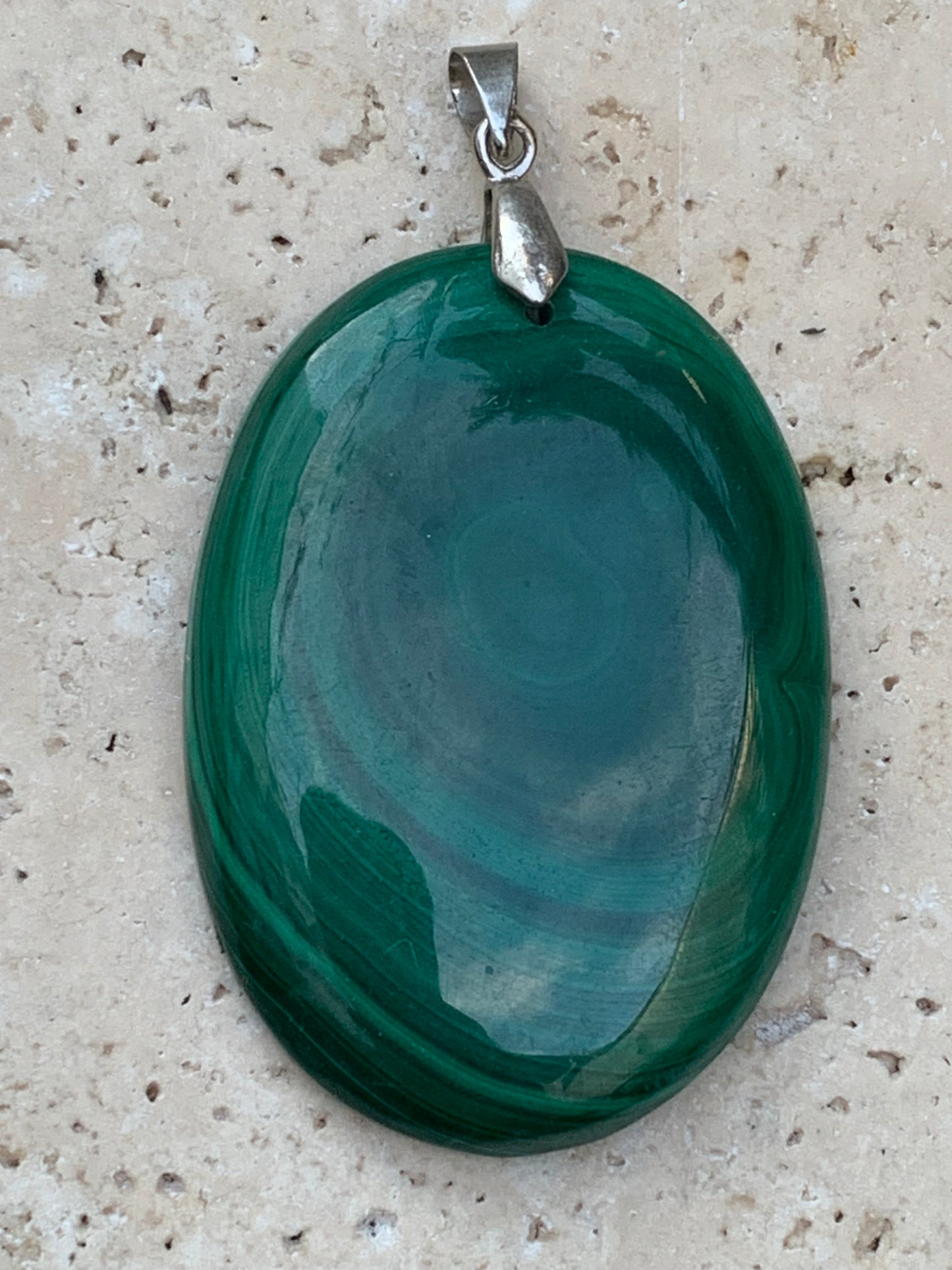 Malachite, superb pendant measuring 60mm high x 35mm wide x 8mm thick. Sold with an adjustable black cord.
