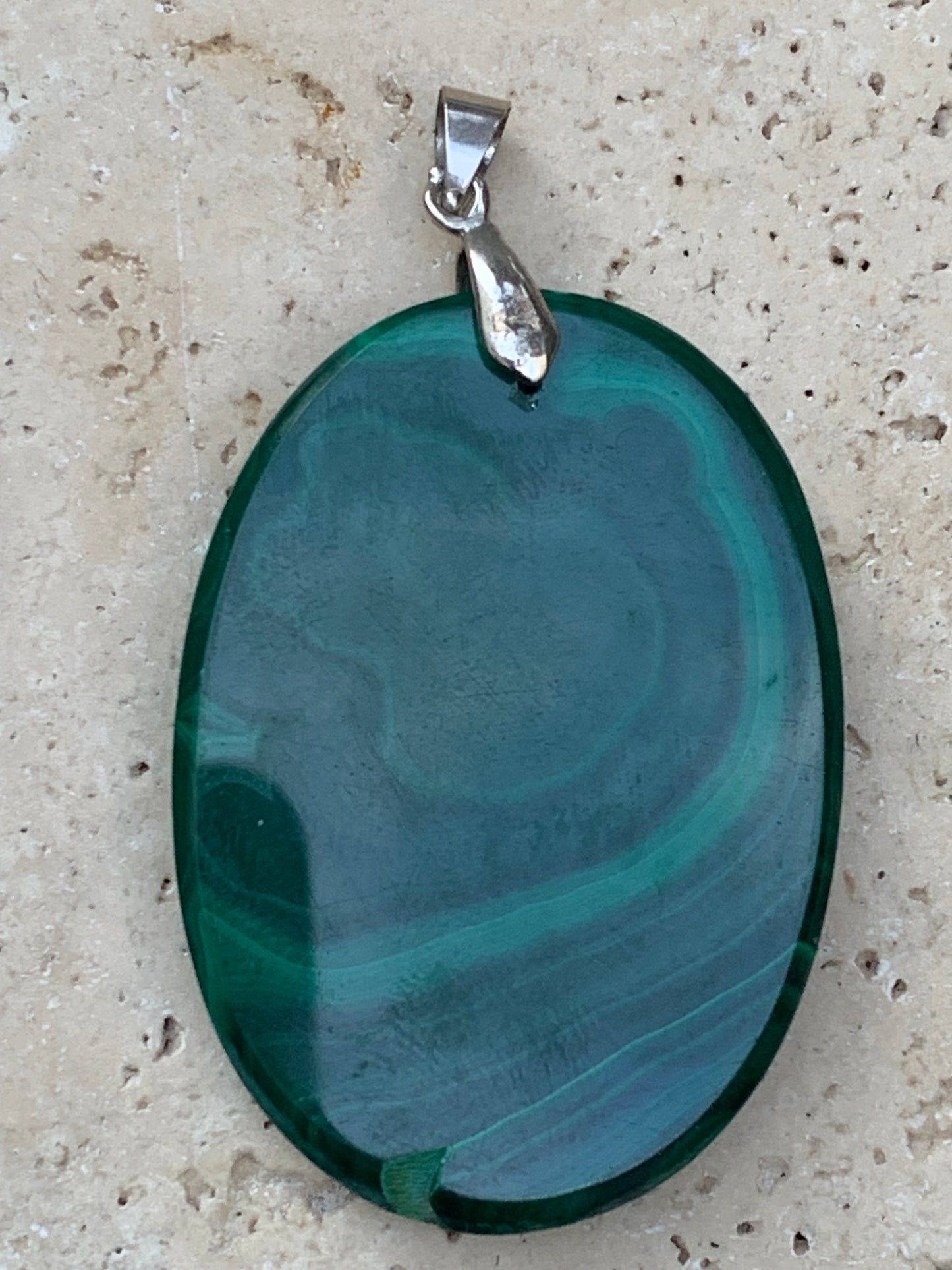 Malachite, superb pendant measuring 60mm high x 35mm wide x 8mm thick. Sold with an adjustable black cord.