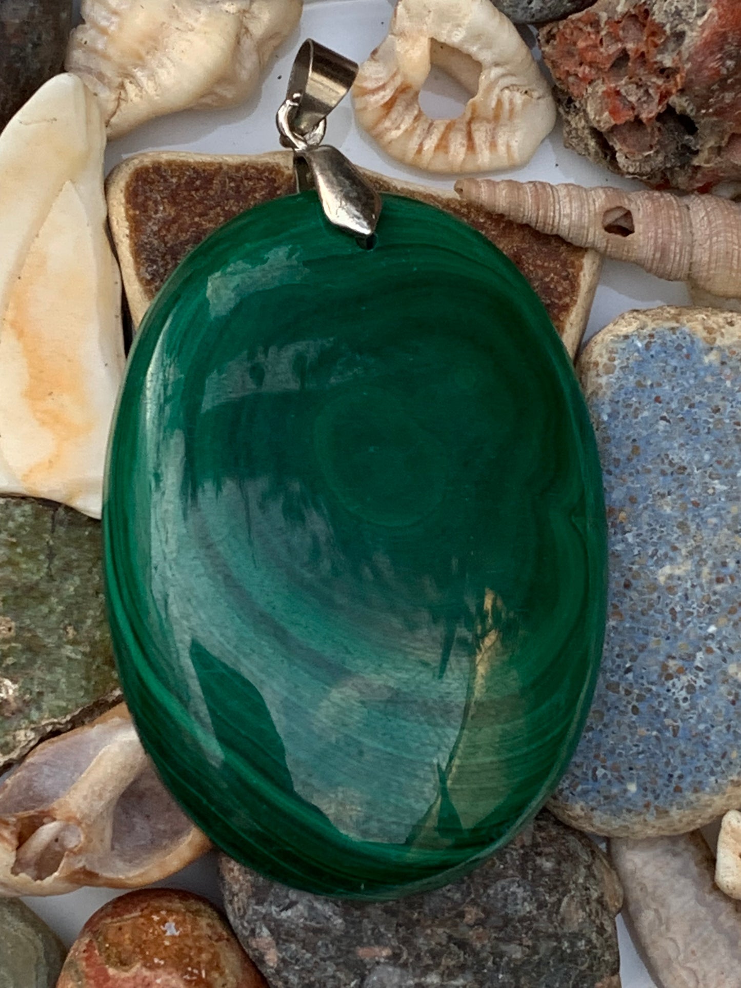 Malachite, superb pendant measuring 60mm high x 35mm wide x 8mm thick. Sold with an adjustable black cord.