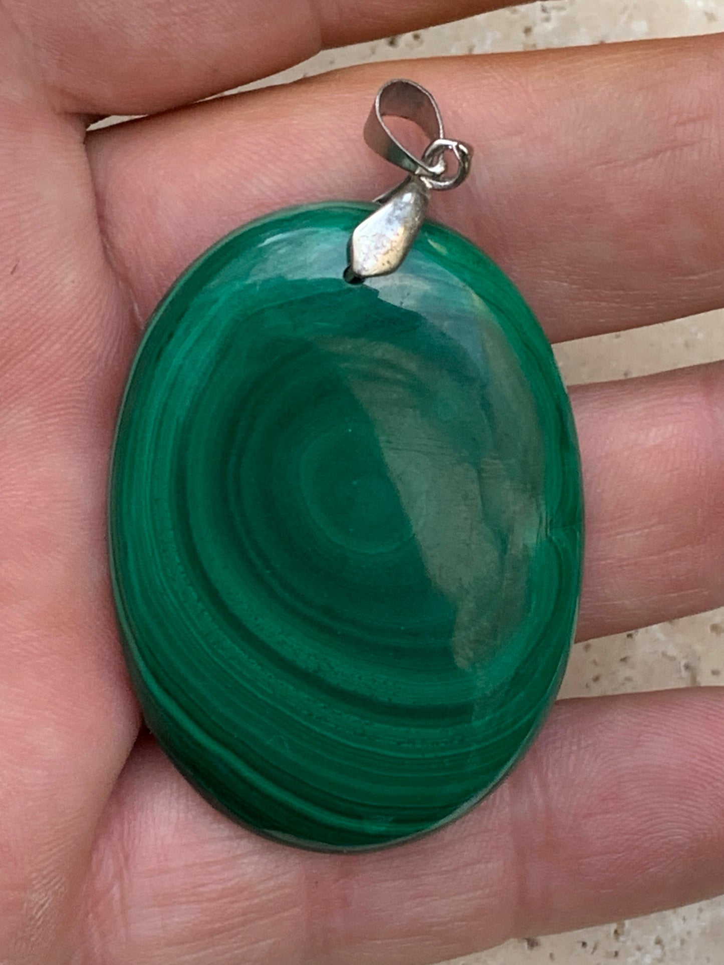 Malachite, superb pendant measuring 60mm high x 35mm wide x 8mm thick. Sold with an adjustable black cord.