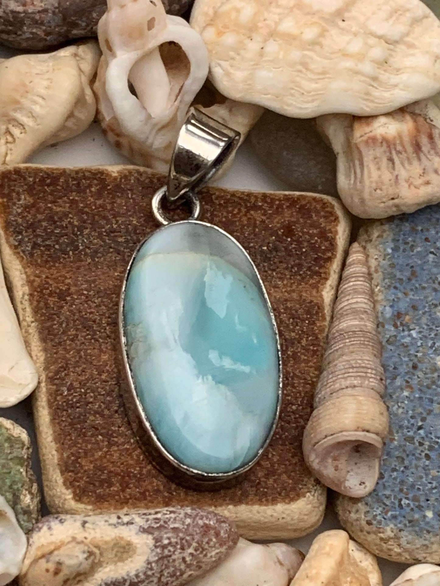 Larimar, Silver pendant, 35mm high x 15mm wide x 7mm thick. Sold with a free adjustable black cord!
