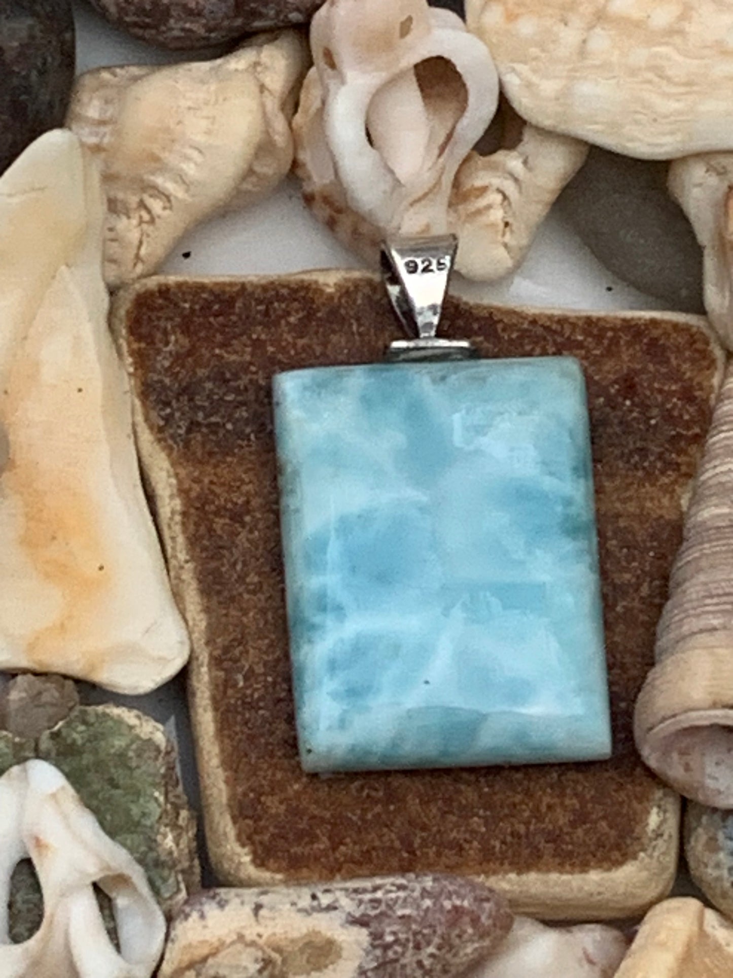 Larimar, Silver pendant, 35 mm high x 17 mm wide x 6 mm thick. Sold with a free adjustable black cord!