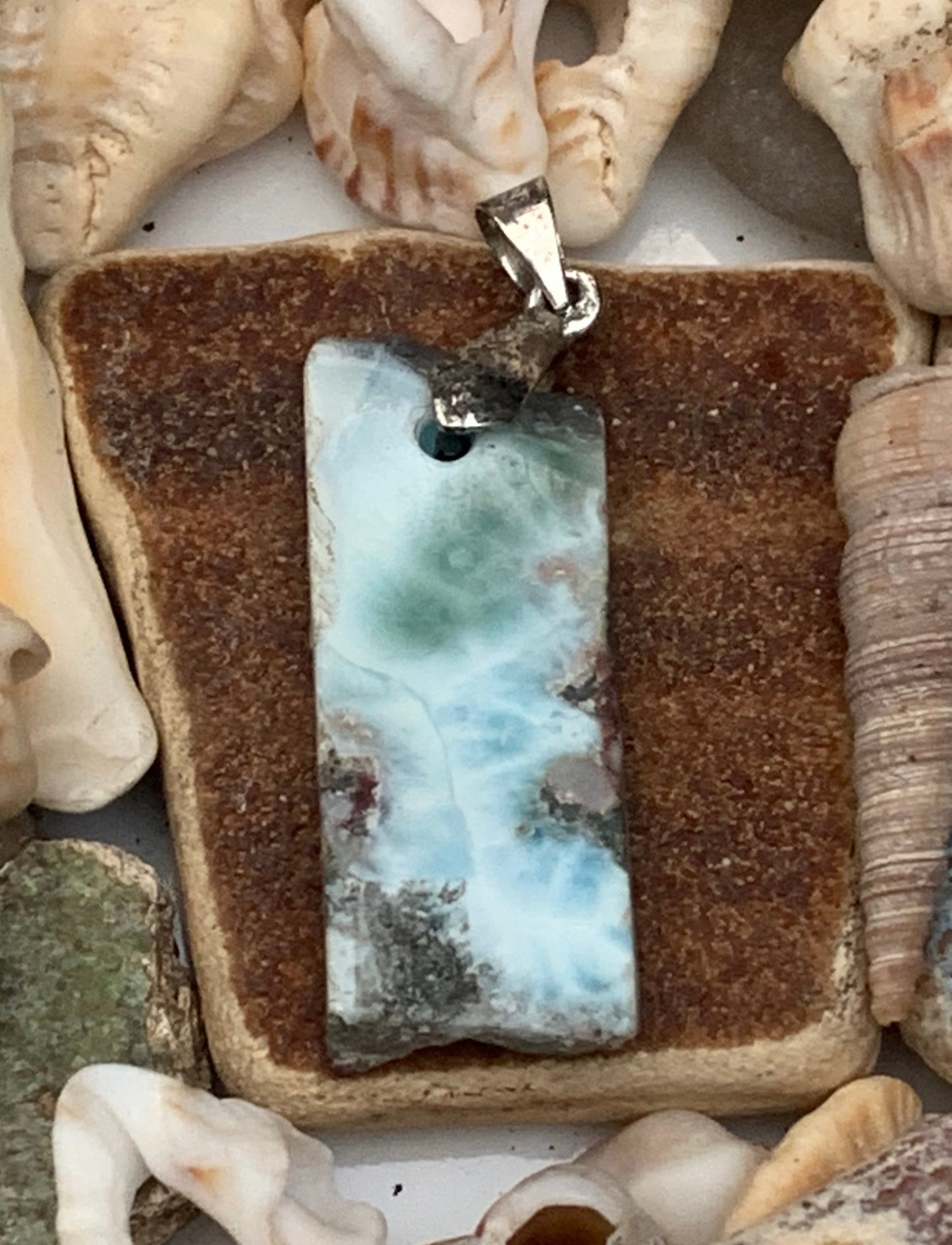 Larimar, Silver pendant, 36 mm high x 12 mm wide x 6 mm thick. Sold with a free adjustable black cord!
