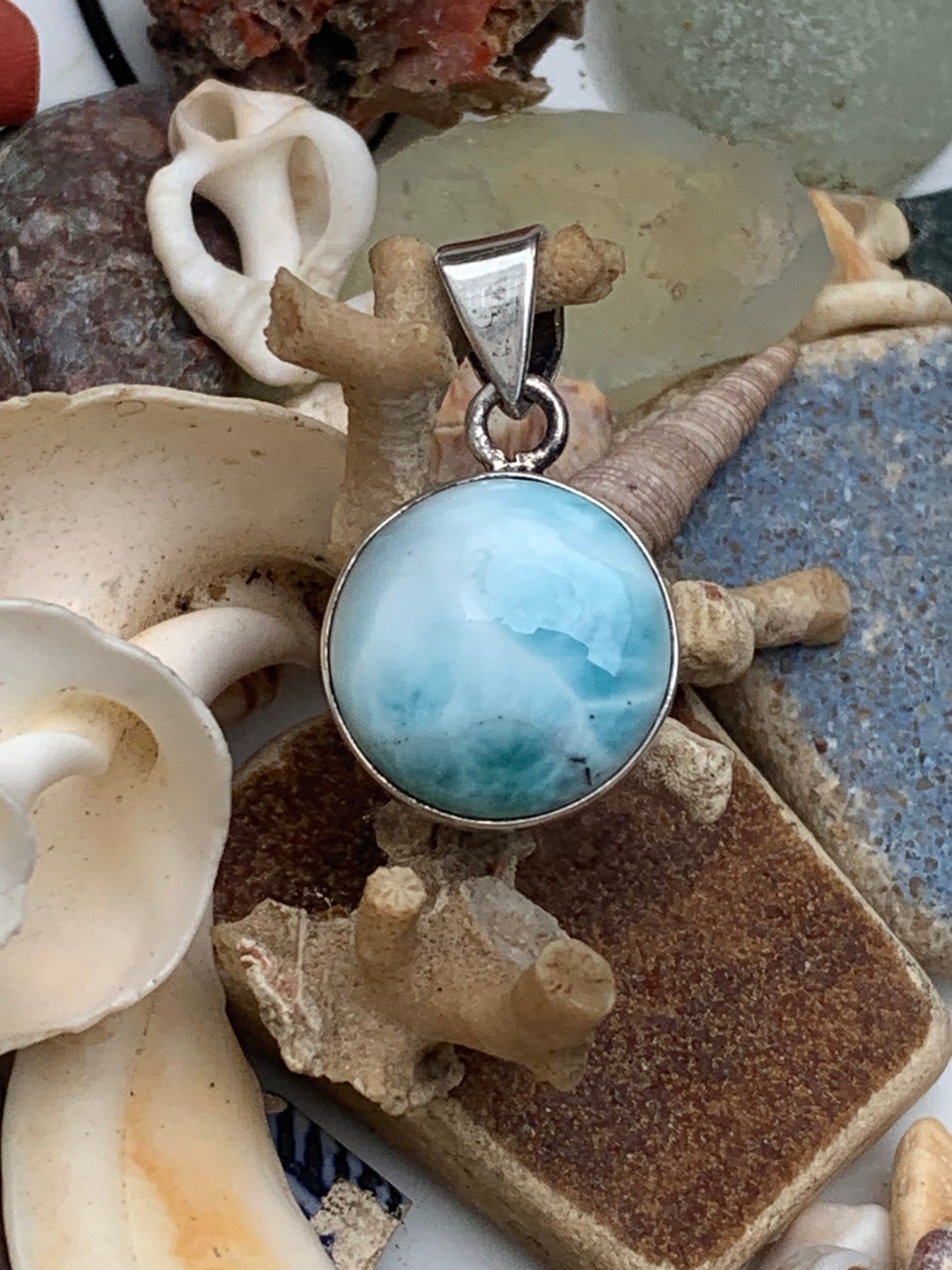 Larimar, Silver pendant, 31mm high x 17mm wide x 6mm thick. Sold with a free adjustable black cord!