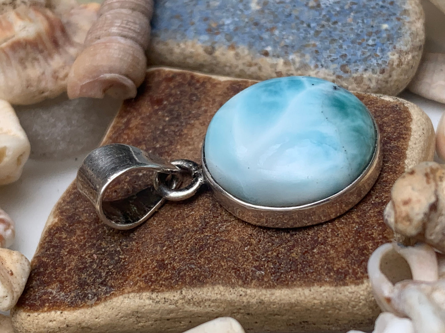 Larimar, Silver pendant, 31mm high x 17mm wide x 6mm thick. Sold with a free adjustable black cord!