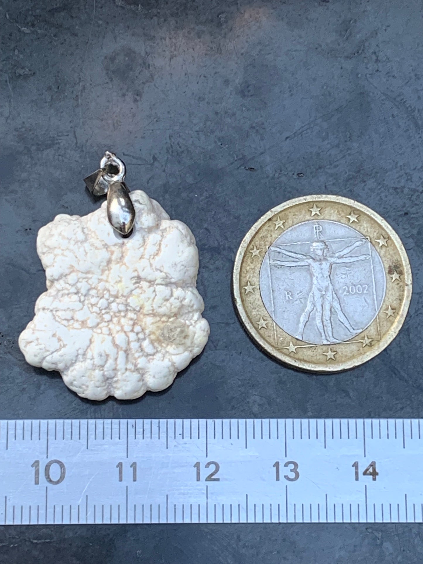 Howlite, pendant 33mm high x 24 wide x 8 thick. Sold with adjustable black cord!