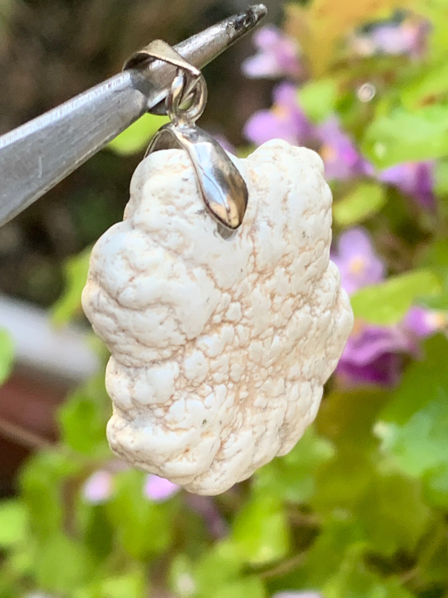 Howlite, pendant 33mm high x 24 wide x 8 thick. Sold with adjustable black cord!