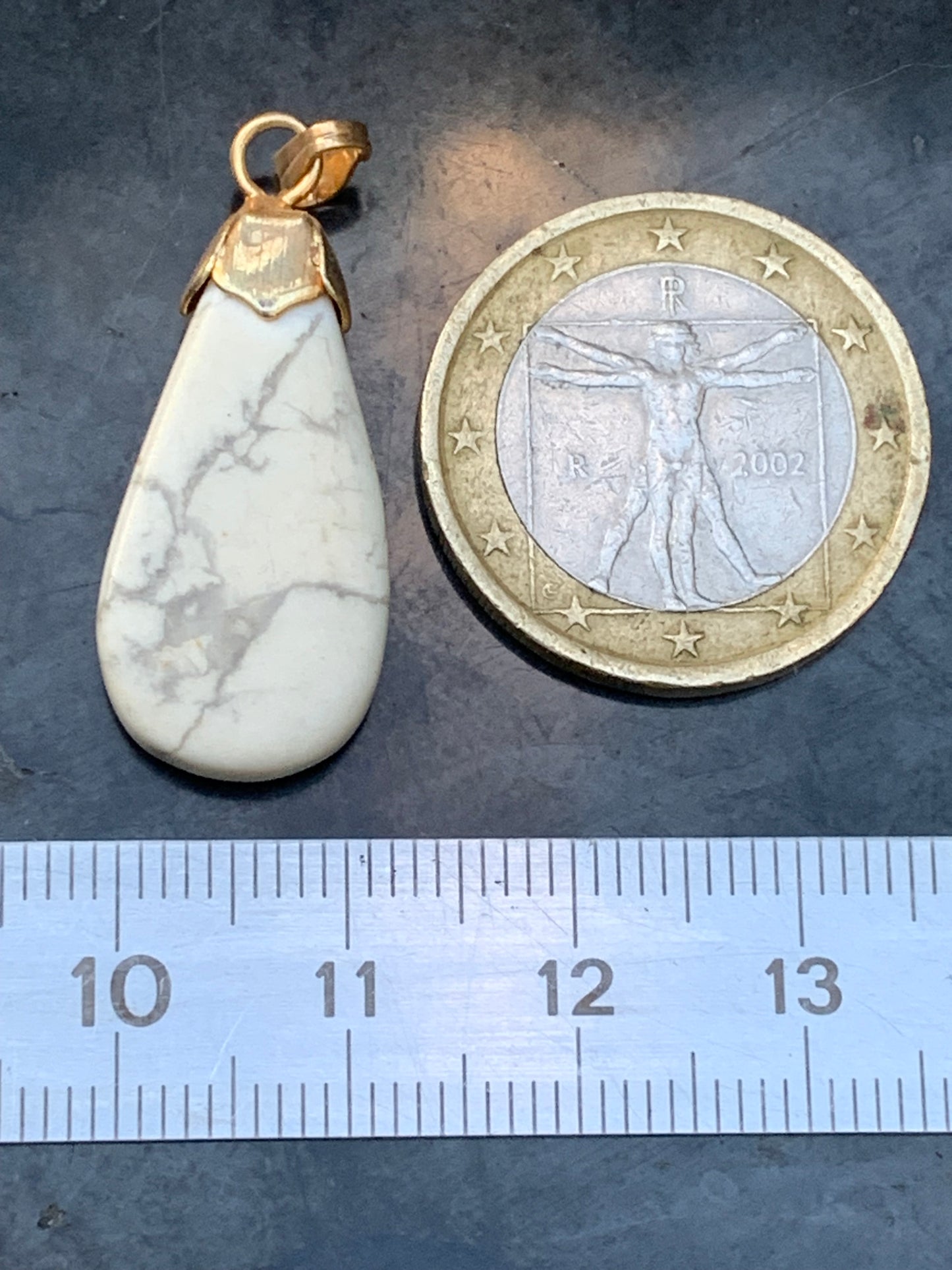 Howlite, pendant 34mm high x 13 wide x 5 thick. Sold with adjustable black cord!
