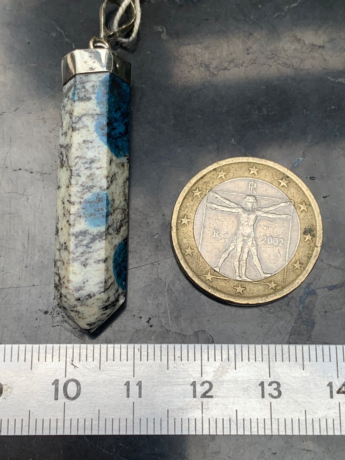 Jasper K2* (Granite with Azurite), piece in rhodium-plated 0925 Silver, 50 millimeters high x 10 millimeters wide x 10 thick. Sold with an adjustable black cord!