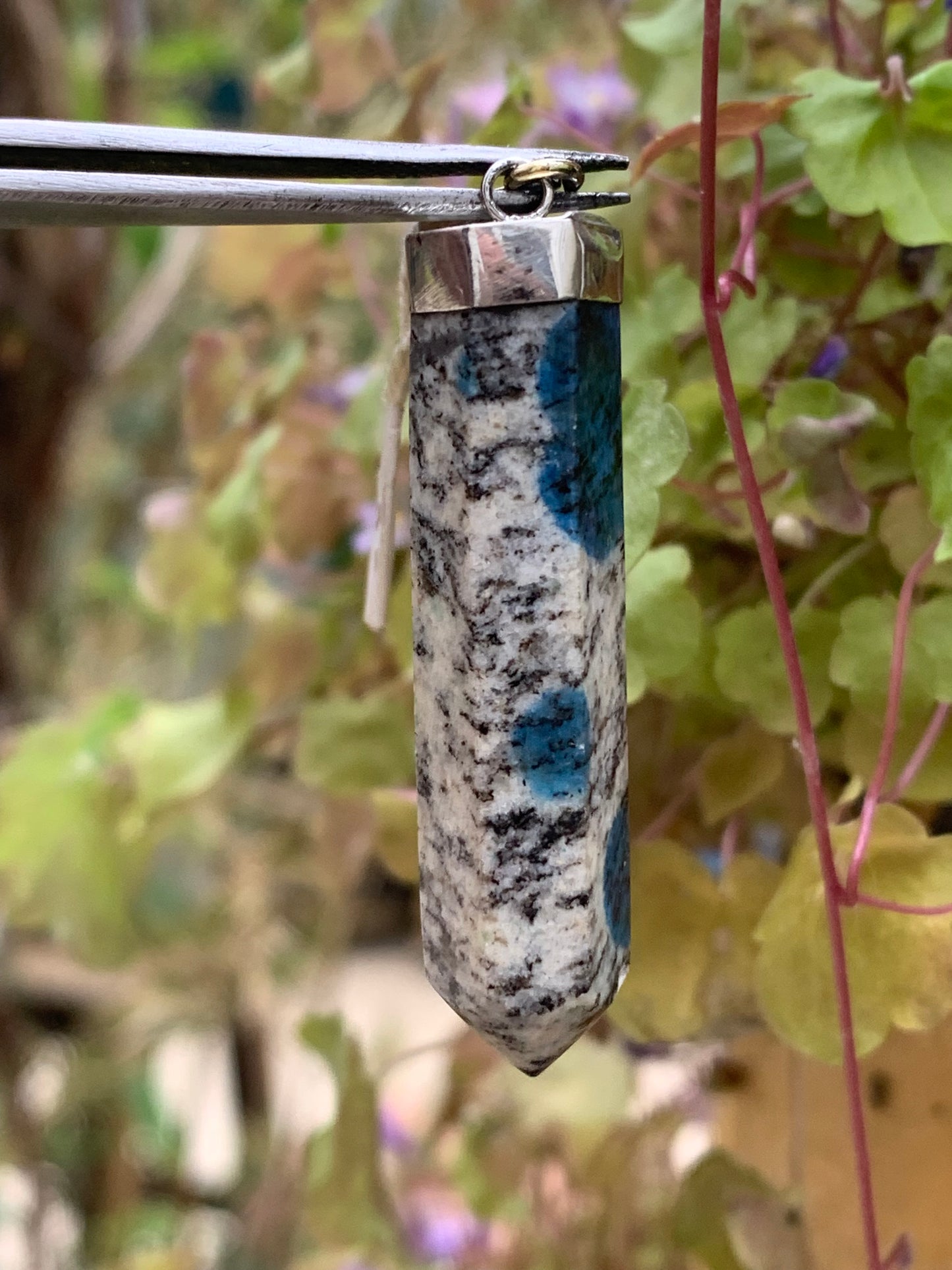 Jasper K2* (Granite with Azurite), piece in rhodium-plated 0925 Silver, 50 millimeters high x 10 millimeters wide x 10 thick. Sold with an adjustable black cord!