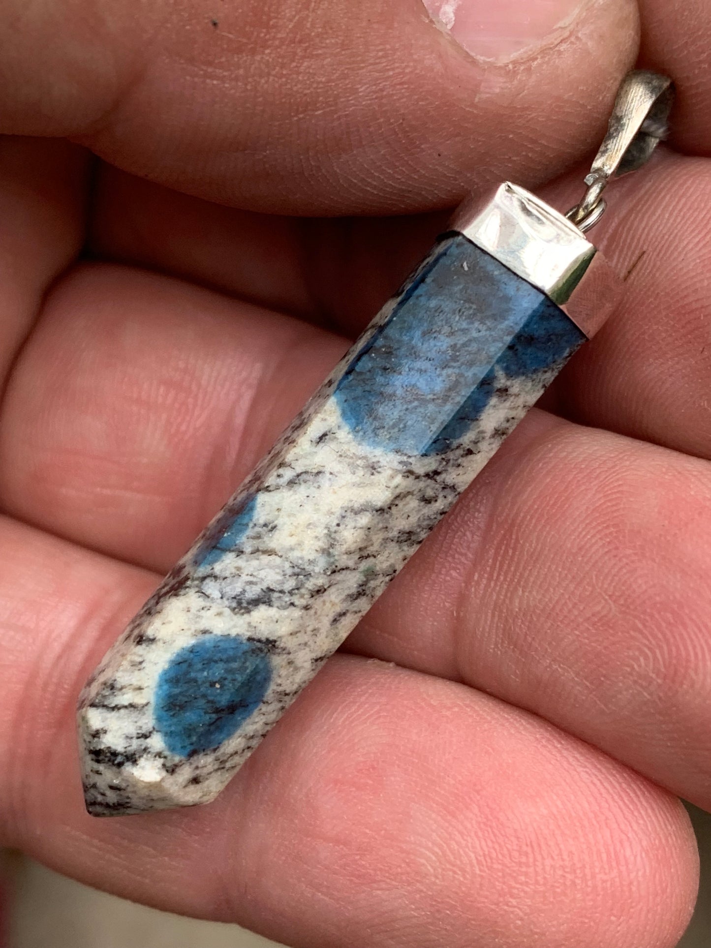 Jasper K2* (Granite with Azurite), piece in rhodium-plated 0925 Silver, 50 millimeters high x 10 millimeters wide x 10 thick. Sold with an adjustable black cord!