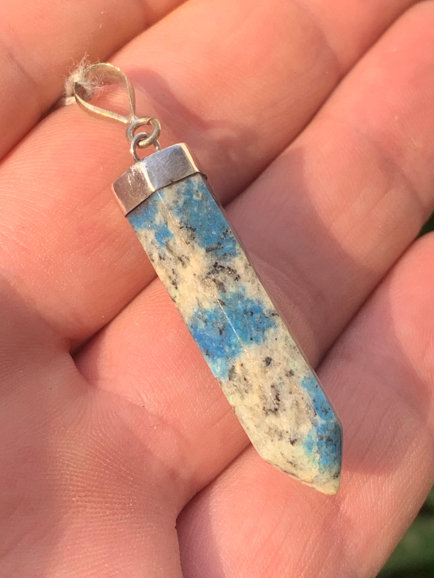 Jasper K2* (Granite with Azurite), piece in rhodium-plated 0925 Silver, 50 millimeters high x 9 millimeters wide x 9 thick. Sold with an adjustable black cord!