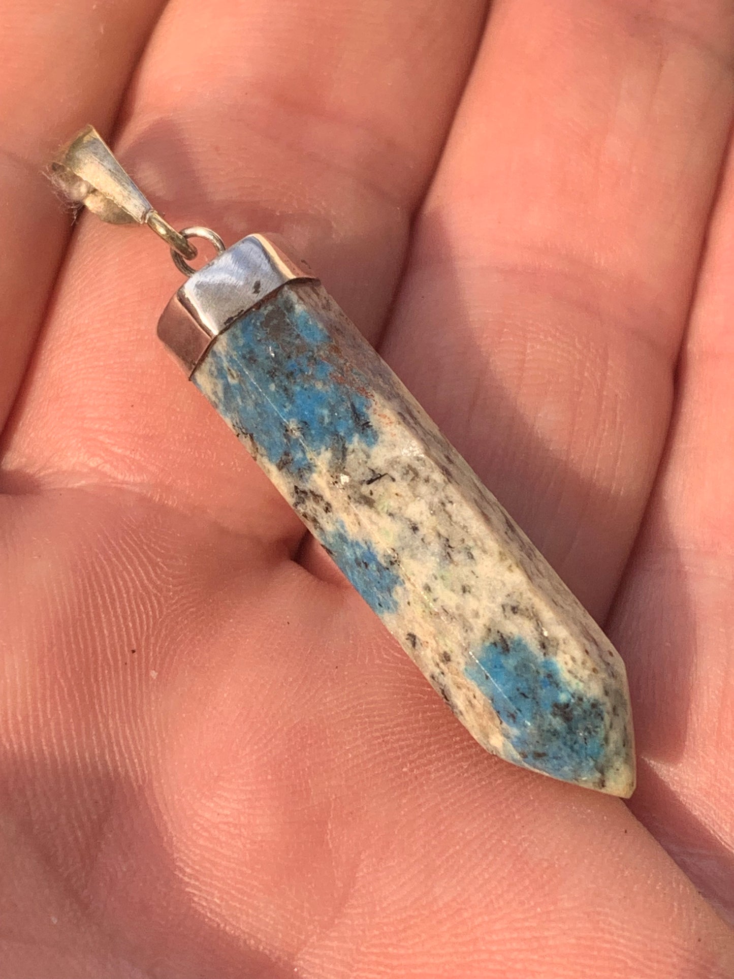 Jasper K2* (Granite with Azurite), piece in rhodium-plated 0925 Silver, 50 millimeters high x 9 millimeters wide x 9 thick. Sold with an adjustable black cord!