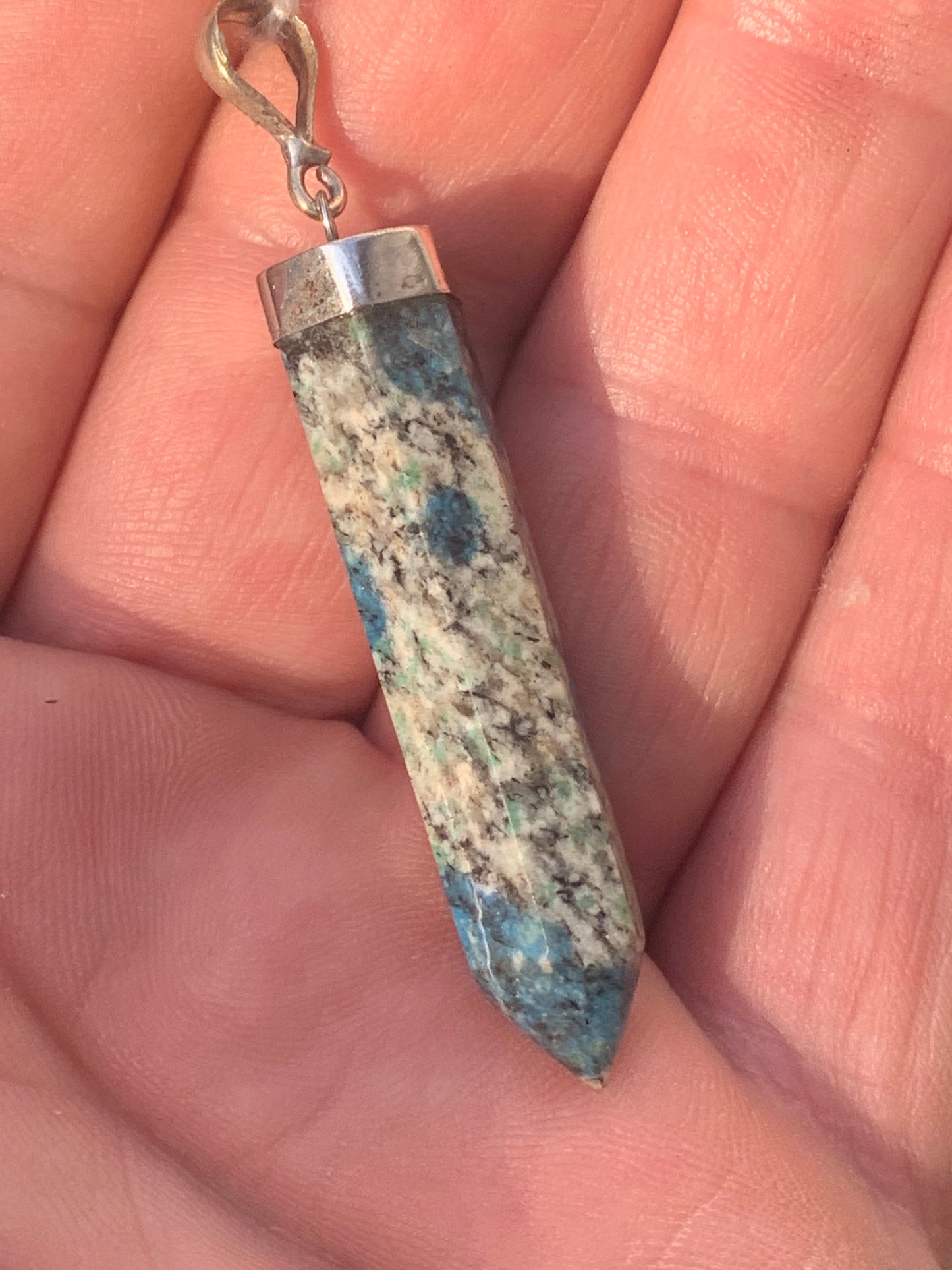 Jasper K2* (Granite with Azurite), piece in rhodium-plated 0925 Silver, 58 millimeters high x 10 millimeters wide x 10 thick. Sold with an adjustable black cord!