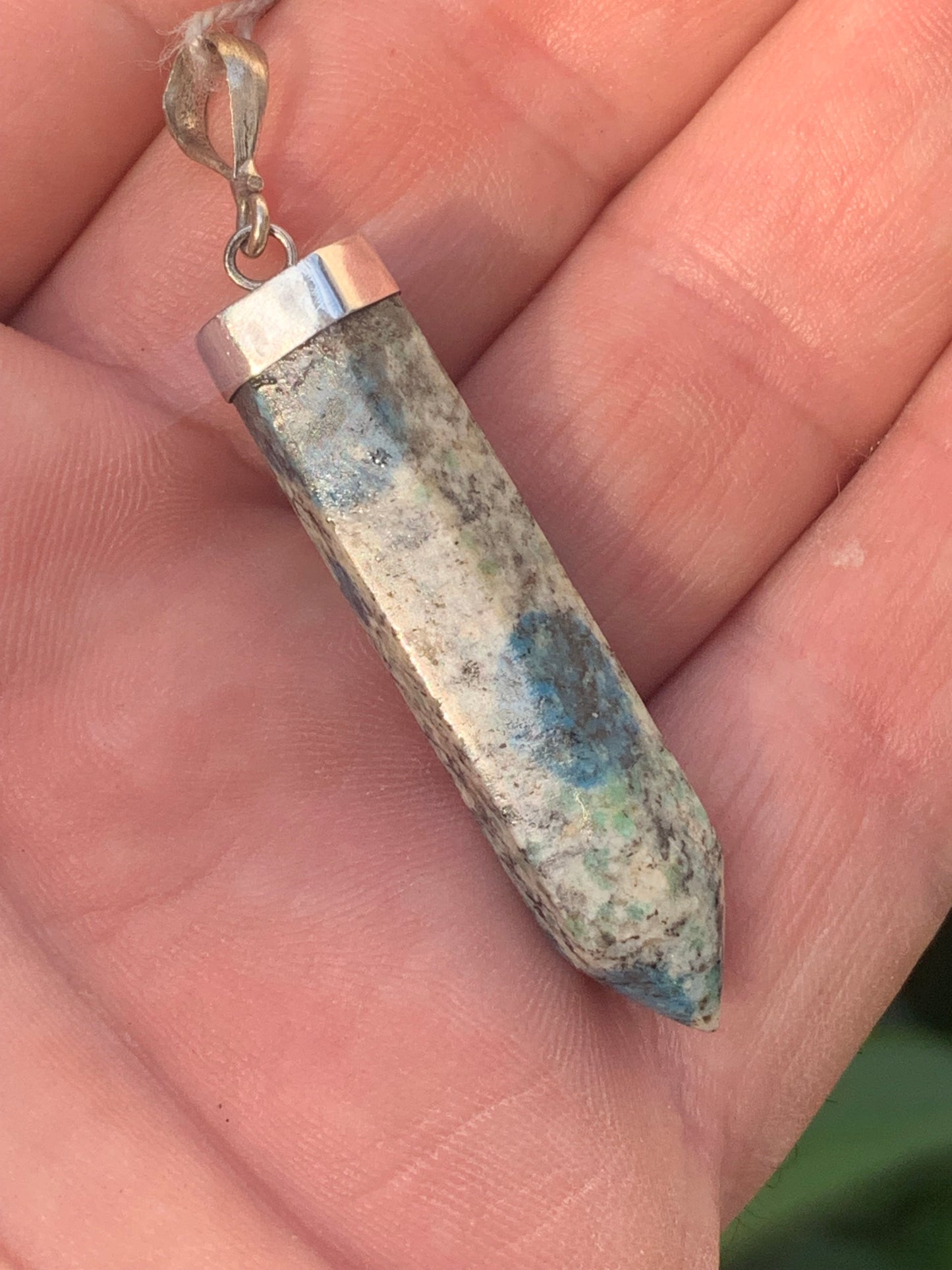 Jasper K2* (Granite with Azurite), piece in rhodium-plated 0925 Silver, 58 millimeters high x 10 millimeters wide x 10 thick. Sold with an adjustable black cord!