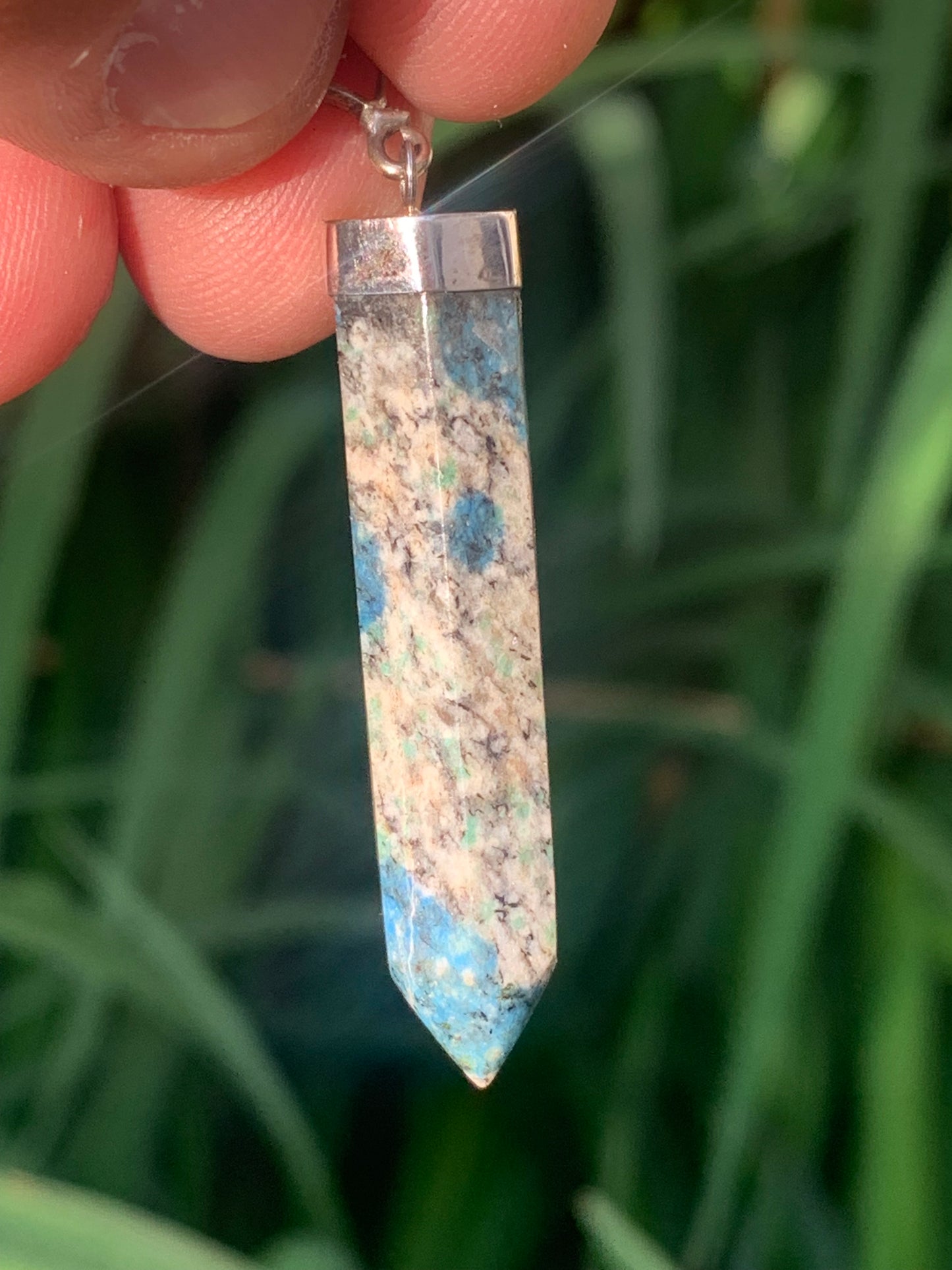 Jasper K2* (Granite with Azurite), piece in rhodium-plated 0925 Silver, 58 millimeters high x 10 millimeters wide x 10 thick. Sold with an adjustable black cord!
