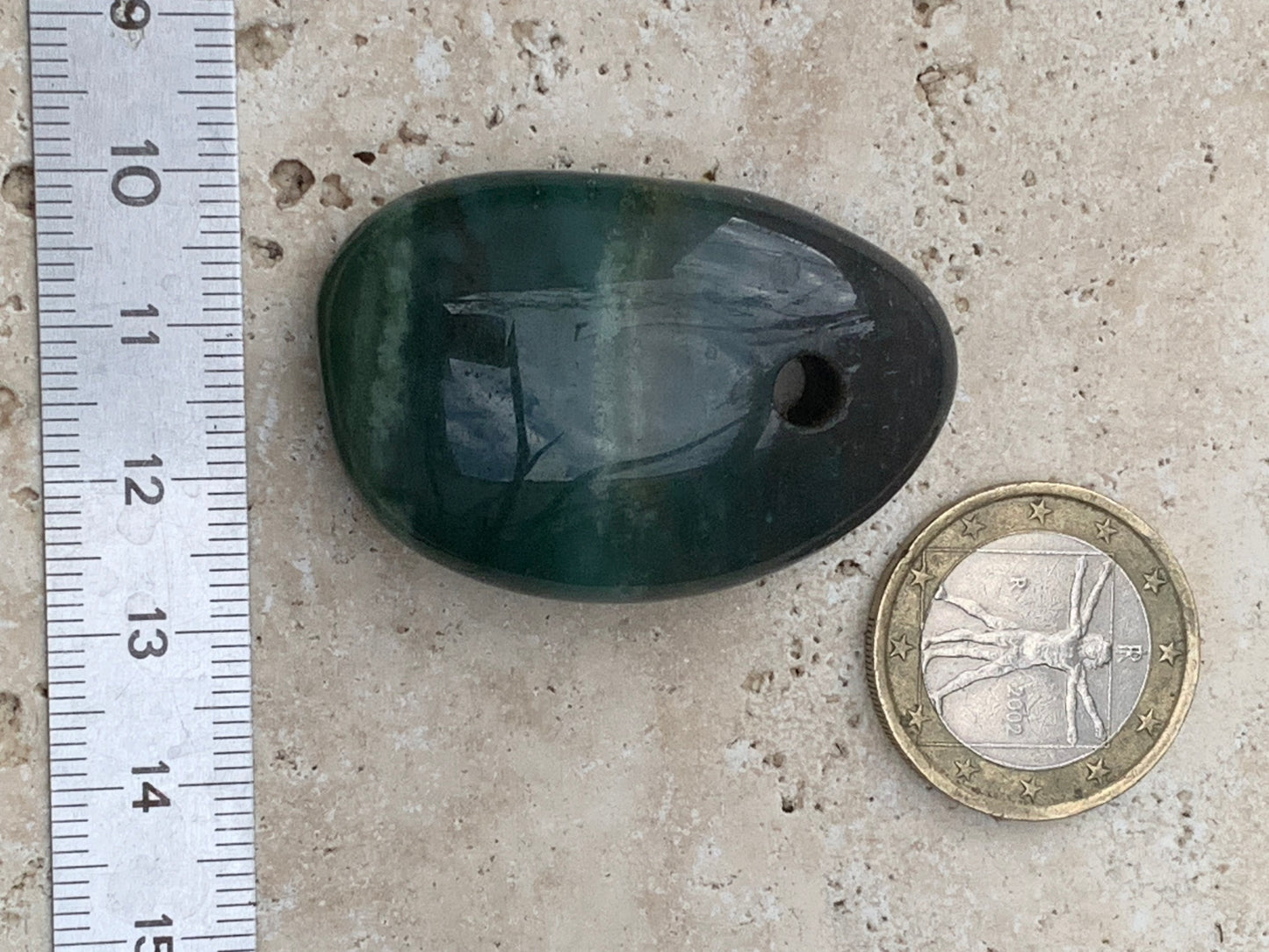 Jade, drilled pebble 43 mm high x 30 wide x 12 thick. Sold with adjustable black cord.