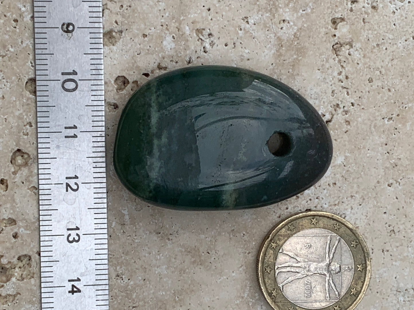 Jade, drilled pebble 43 mm high x 30 wide x 12 thick. Sold with adjustable black cord.