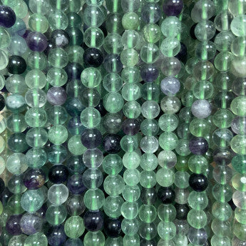 Fluorite multicolore, perles rondes de 4, 6 ou 8 mm. Vendu en fil de perle 38/39 cm, en bracelet de 17 à 21cm, en collier de 45 ou sautoir de 60cm. Qualité AA à AAA !