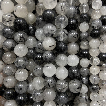 Tourmaline Noire avec cristal de roche (Quartz), perles rondes de 6 et 8 mm, vendu en : fil de perle 38/39 cm, en bracelet de 17 à 21cm, en collier de 45 ou sautoir de 60cm. Qualité AA à AAA, superbes perles naturellement cristalline !