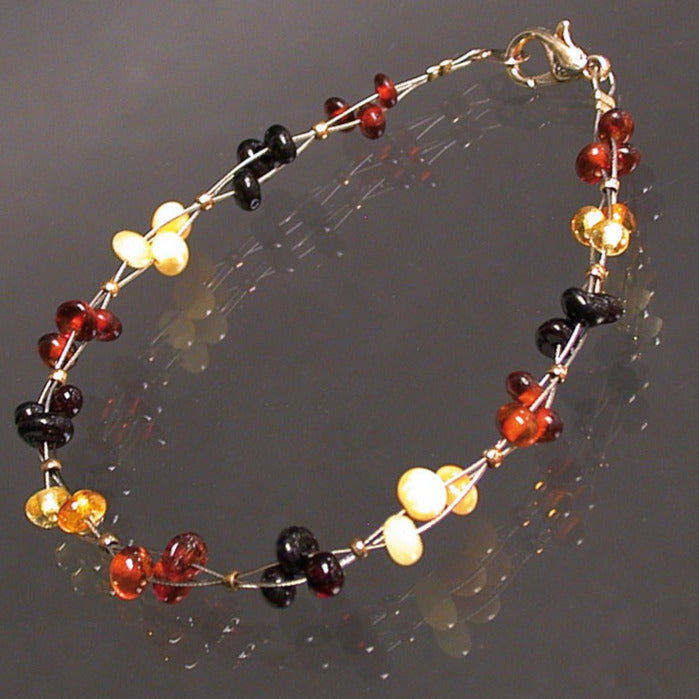 Ambre, bracelet de perles 6 mm à 3 fils torsadés (18 cm) avec fermoir type homard. Une très belle réalisation !