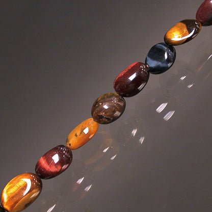 Œil de Tigre/ Œil de Taureau/ Œil de Faucon, bracelet de 17 à 21cm, collier de 42cm et sautoir de 60cm. Perles de type 'Graine' de formes naturelles montées sur fil de haute résistance !