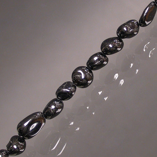 Tourmaline noire, bracelet de 17 à 21cm, collier de 42cm et sautoir de 60cm. Perles de type 'Graine' de formes naturelles montées sur fil de haute résistance !