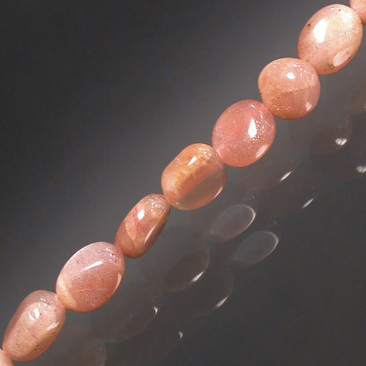 Pierre du soleil, bracelet de 17 à 21cm, collier de 42cm et sautoir de 60cm. Perles de type 'Graine' de formes naturelles montées sur fil de haute résistance !