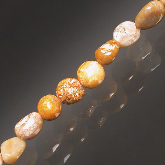 Corail fossile, bracelet de 17 à 21cm, collier de 42cm et sautoir de 60cm. Perles de type 'Graine' de formes naturelles montées sur fil de haute résistance !