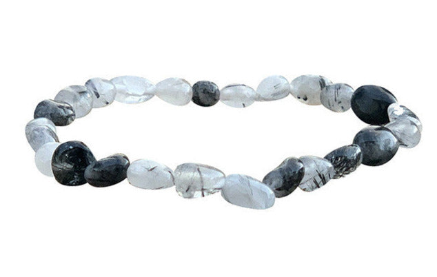 Cristal de roche (Quartz) avec Tourmaline noire, bracelet de 17 à 21cm, collier de 42cm et sautoir de 60cm. Perles de type 'Graine' de formes naturelles montées sur fil de haute résistance !