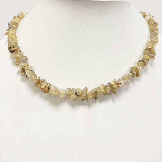 Cristal de roche (Quartz) a rutile doré, bracelet de 17 à 21cm, collier de 42cm et sautoir de 60cm. Perles de type 'Baroque' de formes naturelles montées sur fil de haute résistance !