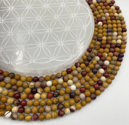 Jaspe Mokaïte, perles rondes de 6 ou 8 mm. Vendu en fil de perle 38/39 cm, en bracelet de 17 à 21cm, en collier de 45 ou sautoir de 60cm. Qualité AA à AAA !